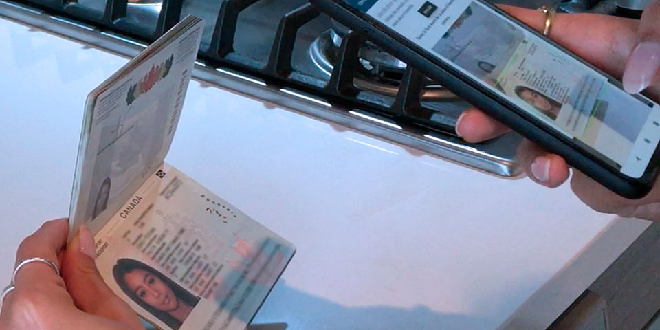 Woman scanning passport with smartphone